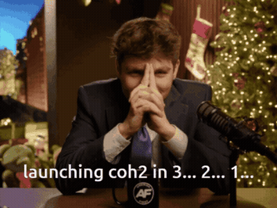 A Man Sitting In Front Of A Microphone With The Words Launching Coh2 In 3 In The Corner GIF