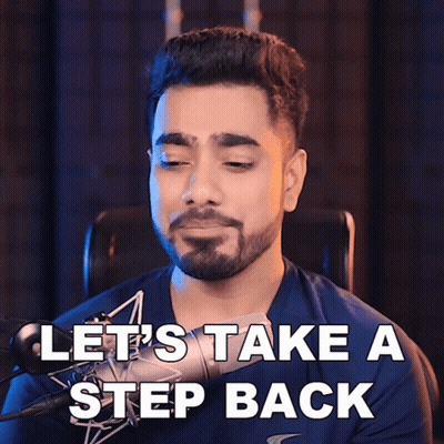 A Man Sitting In Front Of A Microphone With The Words Let 'S Take A Step Back GIF