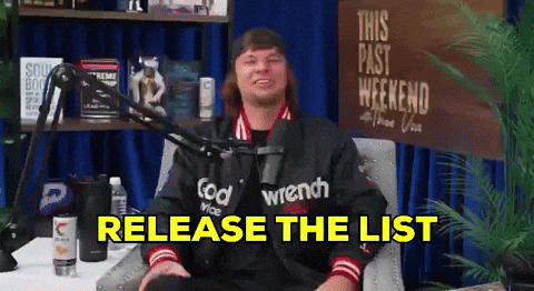 A Man Sitting In Front Of A Microphone With The Words Release The List GIF