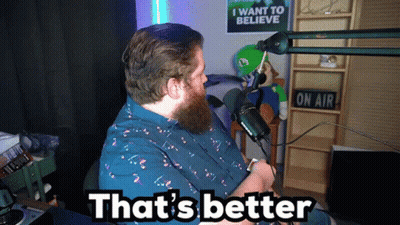 A Man Sitting In Front Of A Microphone With The Words That 'S Better On The Bottom GIF