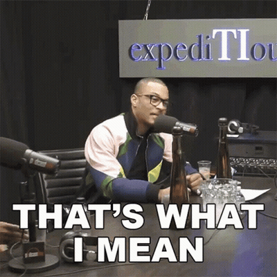 A Man Sitting In Front Of A Microphone With The Words That 'S What I Mean GIF