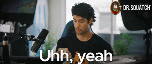 A Man Sitting In Front Of A Microphone With The Words " Uhh Yeah " On The Bottom GIF