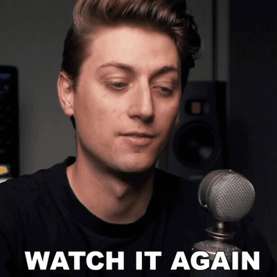 A Man Sitting In Front Of A Microphone With The Words Watch It Again On The Bottom GIF