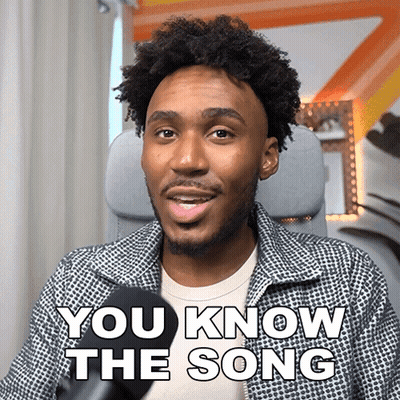 A Man Sitting In Front Of A Microphone With The Words " You Know The Song " On His Face GIF