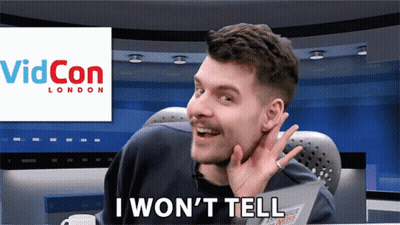 A Man Sitting In Front Of A Screen That Says " I Won 'T Tell " GIF