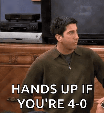 A Man Sitting In Front Of A Television With The Words Hands Up If You 'Re 4-0 GIF
