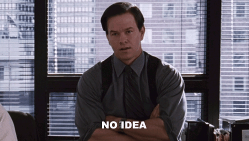 A Man Sitting In Front Of A Window With His Arms Crossed Says No Idea GIF
