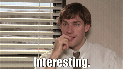 A Man Sitting In Front Of A Window With The Words Interesting Written On The Screen GIF