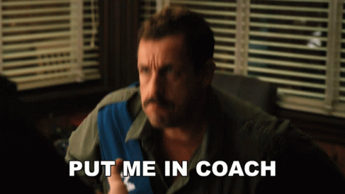 A Man Sitting In Front Of A Window With The Words Put Me In Coach Below Him GIF