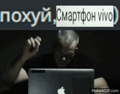 A Man Sitting In Front Of An Apple Laptop With A Makeagif.com Watermark On The Bottom GIF