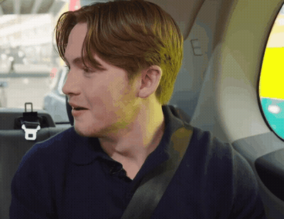 A Man Sitting In The Back Seat Of A Car GIF