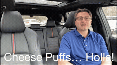 A Man Sitting In The Back Seat Of A Car Talking About Cheese Puffs Holla GIF