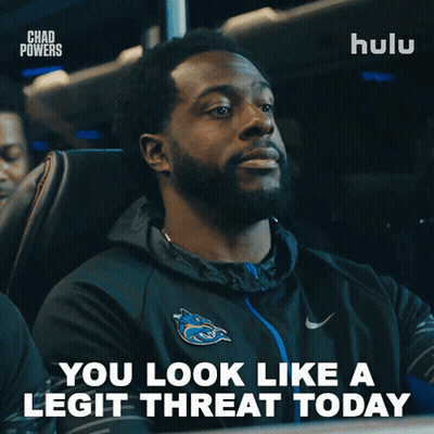 A Man Sitting On A Bus With The Words You Look Like A Legit Threat Today GIF