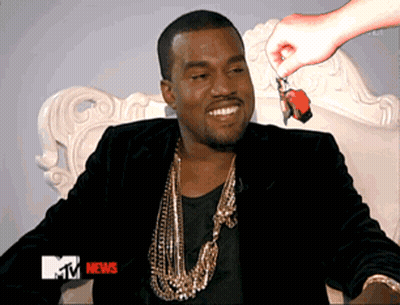 A Man Sitting On A Chair With A Mtv News Advertisement GIF