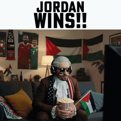 A Man Sitting On A Couch Holding A Popcorn Bucket With The Words Jordan Wins Below Him GIF