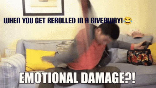 A Man Sitting On A Couch With A Caption That Says Emotional Damage GIF