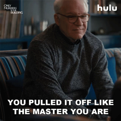 A Man Sitting On A Couch With A Hulu Logo In The Background GIF