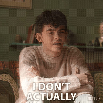 A Man Sitting On A Couch With His Arms Crossed And The Words I Do N't Actually Written Below Him GIF