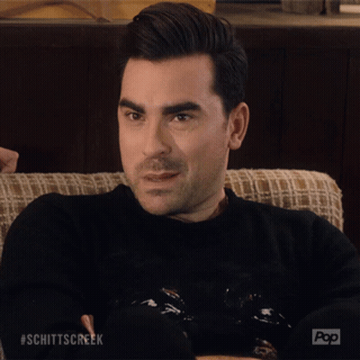 a man sitting on a couch with his eyes closed and the word okay written on his face