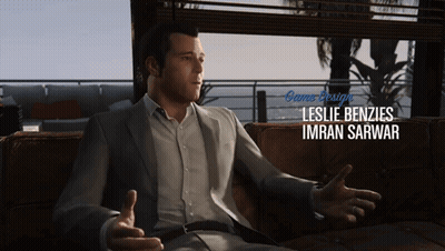 A Man Sitting On A Couch With The Name Leslie Benzies Imran Sarwar GIF