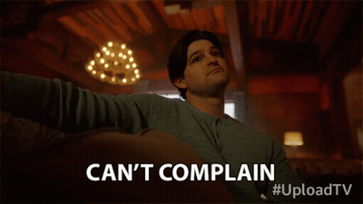 A Man Sitting On A Couch With The Words Can 'T Complain GIF