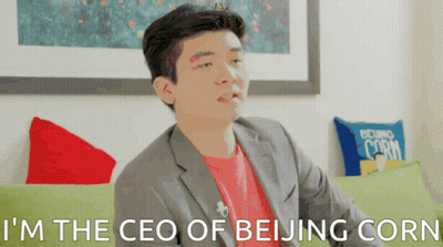 A Man Sitting On A Couch With The Words I 'M The Ceo Of Beijing Corn GIF