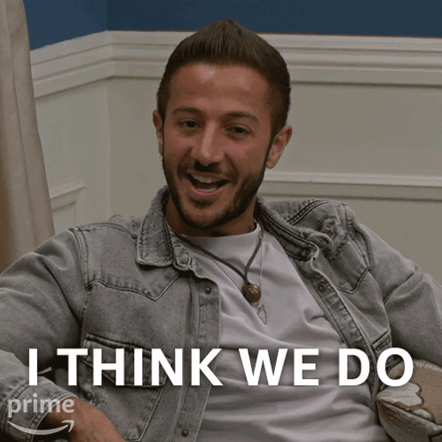 A Man Sitting On A Couch With The Words " I Think We Do " Above Him GIF