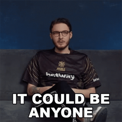 A Man Sitting On A Couch With The Words It Could Be Anyone Written On The Bottom GIF