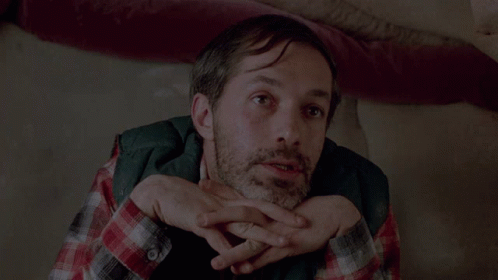 A Man Sitting On A Couch With The Words My Art Keeps Me Sane On The Bottom GIF