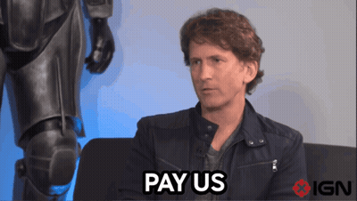 A Man Sitting On A Couch With The Words Pay Us Above Him GIF