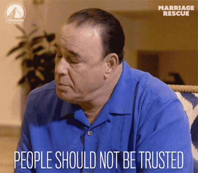 A Man Sitting On A Couch With The Words People Should Not Be Trusted Written Below Him GIF