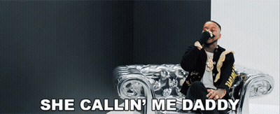 A Man Sitting On A Couch With The Words She Callin ' Me Daddy GIF