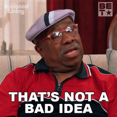 A Man Sitting On A Couch With The Words That 'S Not A Bad Idea On His Shirt GIF