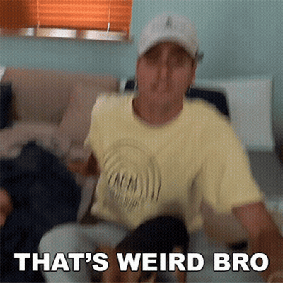 A Man Sitting On A Couch With The Words That 'S Weird Bro Written Below Him GIF