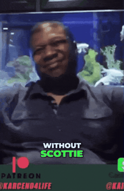 A Man Sitting On A Couch With The Words " Without Scottie " On The Bottom Right GIF