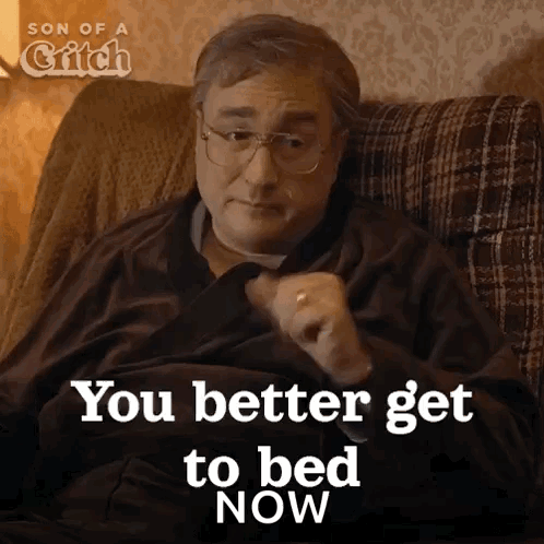 A Man Sitting On A Couch With The Words You Better Get To Bed Now GIF