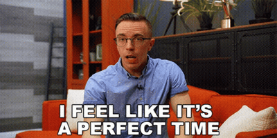 A Man Sitting On A Red Couch With The Words I Feel Like It 'S A Perfect Time Above Him GIF