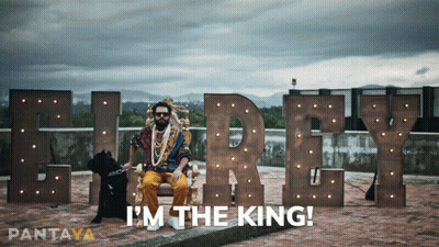 A Man Sitting On A Throne Next To A Dog With The Words I 'M The King On The Bottom GIF