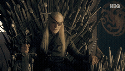 A Man Sitting On A Throne With A Sword And A Hbo Logo In The Background GIF