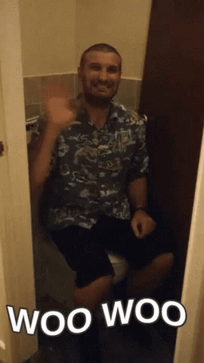 A Man Sitting On A Toilet With The Words Woo Woo Written Below Him GIF