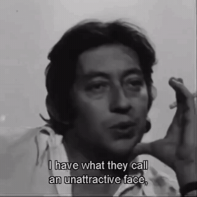 A Man Smoking A Cigarette And Saying " I Have What They Call An Unattractive Face " GIF