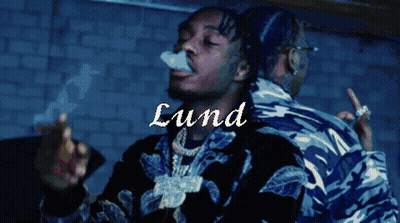 A Man Smoking A Cigarette With The Name Lund Written On The Bottom GIF