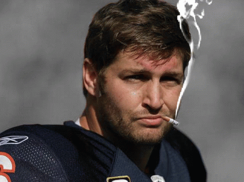 A Man Smoking A Cigarette With The Number 3 On His Shirt GIF