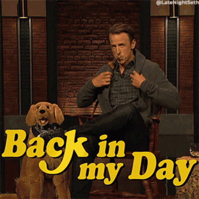 A Man Smoking A Pipe Next To A Dog With The Words Back In My Day On The Bottom GIF