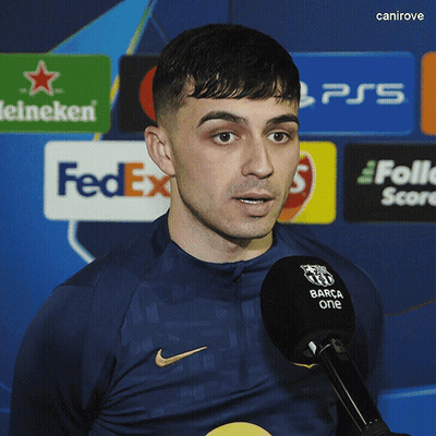 A Man Speaking Into A Microphone With A Fedex Logo In The Background GIF
