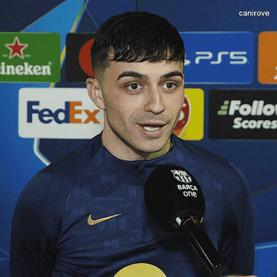 A Man Speaking Into A Microphone With A Fedex Logo In The Background GIF