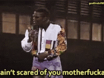 A Man Speaking Into A Microphone With The Words Ain T Scared Of You Motherfucker GIF