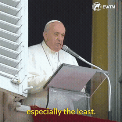 A Man Speaking Into A Microphone With The Words " Especially The Least " Next To Him GIF