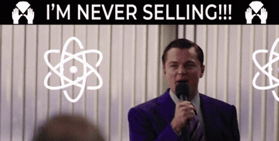 A Man Speaking Into A Microphone With The Words I 'M Never Selling Behind Him GIF