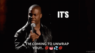 A Man Speaking Into A Microphone With The Words It 'S About To Go Down Behind Him GIF